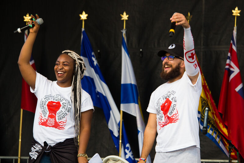 Celebration moment with attendees raising their arms