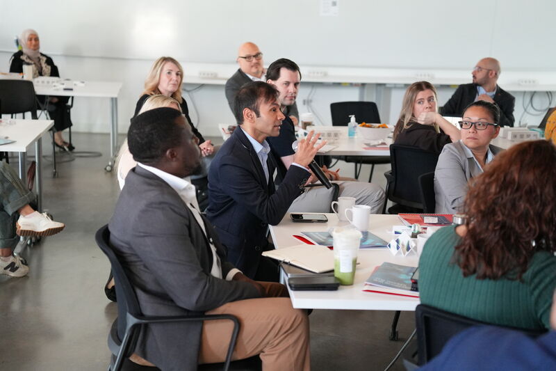 Attendees in a roundtable discussion