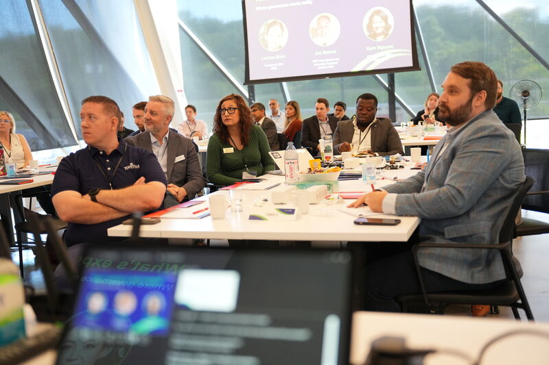Participants seated at a roundtable session