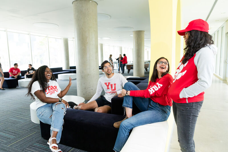 Students in team shirts at a campus event