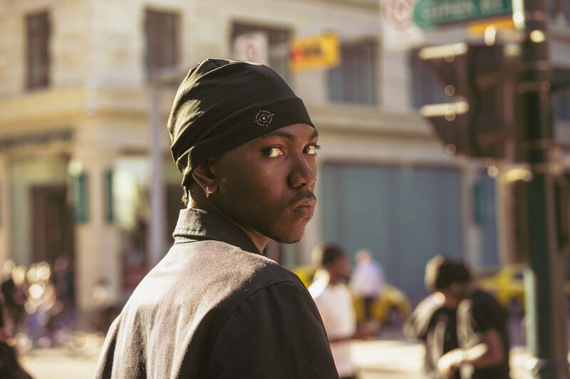 Two models in white durags in warm evening light